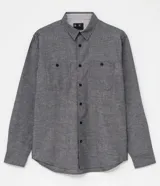 Camisa de manga larga de la marca Ripping, confeccionada en 100% algodón de color gris melange. Cuenta con cuello camisero, cierre frontal de botones, puños abotonados y un bolsillo aplicado en el pecho con cierre de botón.