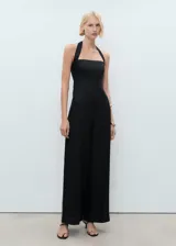 Mono largo de lino con escote halter y tirantes anchos. Presenta un diseño de corte recto, cierre de cremallera en la parte posterior y panel fruncido elástico para un mejor ajuste.