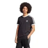 Remera negra de corte clásico con cuello redondo y mangas cortas con ribete blanco. Presenta las tres rayas blancas características de Adidas en los hombros y el logo del trifolio bordado en blanco en el pecho.