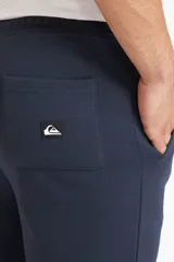 Pantalón de jogging Quiksilver para hombre, color azul marino, con cintura elástica con cordón ajustable, bolsillos laterales y puños elásticos en los tobillos.