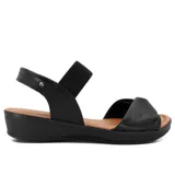 Sandalias de cuero negro con taco bajo y capellada con tiras cruzadas.