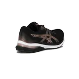 Championes Asics Gel-Nagoya 6 de running para mujer, en color negro con detalles metalizados en tono rosado o cobre, entresuela blanca y suela negra.