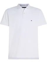 Chomba blanca de piqué de algodón elástico, corte regular, cuello clásico y logo de Tommy Hilfiger bordado en el pecho.