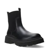 Botas Chelsea de mujer, color negro, con caña corta y elásticos laterales acanalados. Suela track gruesa y dentada.