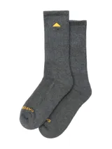 Medias gris melange de largo medio, con tejido acanalado, suela acolchada y detalles bordados en color amarillo que incluyen un triángulo en la pantorrilla y el texto de la marca en la puntera.