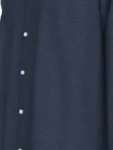 Camisa de manga larga Tommy Hilfiger de algodón Oxford color azul con cuello abotonado y logo bordado en el pecho.