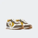 Championes Converse Omega Trainer Lux, inspirados en el running de los 80, color blanco con detalles en marrón, amarillo y suela caramelo.