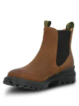 Botín tipo Chelsea color marrón, con paneles elásticos laterales negros y tiradores superiores con detalle de tejido amarillo. Cuenta con una suela de goma robusta y dentada de color negro, diseñada con tecnología de amortiguación.