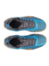 Championes de entrenamiento Under Armour modelo TriBase Reign 6, color azul brillante con suela de goma color caramelo. Presentan tecnología UA WARP en la parte superior para mayor sujeción, mediasuela de doble densidad y tecnología TriBase para maximizar el contacto con el suelo y la estabilidad durante ejercicios de levantamiento y movimientos dinámicos.