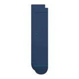 Pack de tres pares de medias de caña media Stance, modelo Icon. Incluye un par negro, un par azul marino y un par blanco. Presentan tejido acanalado en la parte superior, logo bordado sutil en el lateral y detalle de marca en la puntera.
