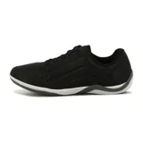Championes urbanos Kolosh de mujer, color negro con suela gris y logo en el lateral.