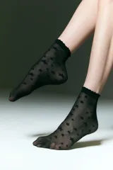 Soquete de red transparente color negro con estampado de estrellas y borde superior con terminación ondulada.