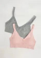 Pack de dos soutiens modelo top, sin aro, de microfibra y encaje, con copas removibles, sin costura y con breteles ajustables. Incluye un soutien gris y uno rosado.