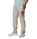 Pantalón cortavientos Columbia Challenger Windbreak Omni-Shield en color gris con paneles laterales en verde oliva y marrón, con dobladillo ajustable mediante cordón elástico.