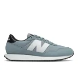 Championes New Balance modelo 237, color celeste con detalles en blanco y negro.