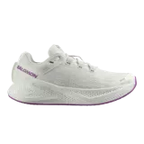 Championes de running Salomon modelo Aero Glide 3, color blanco con detalles en lila y suela morada. Cuentan con amortiguación de alta densidad y capellada de malla sin costuras.