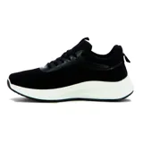 Championes de running para hombre, color negro con suela blanca gruesa y logo lateral en forma de '7' estilizado en color celeste claro.