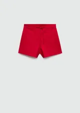 Short de tiro medio confeccionado en mezcla de lino y algodón. Presenta diseño corto, cierre lateral con cremallera invisible, trabillas en la cintura y lazo ajustable. Incluye dos bolsillos de ribete delanteros.