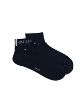 Medias tobilleras azul marino Tommy Hilfiger, con logo bordado en el puño y pequeños detalles tricolores característicos de la marca.