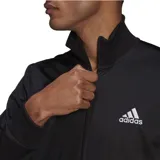 Conjunto deportivo Adidas para hombre, compuesto por una campera con cierre frontal y cuello alto, y un pantalón de corte ajustado. Ambas piezas son de color negro y presentan el logo de la marca bordado en blanco.