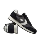 Championes Converse Omega Trainer de caña baja, color gris y negro, con logo estrella y galón en blanco, capellada de gamuza y tela, y suela de goma.