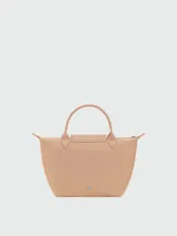 Cartera de mano Longchamp modelo Le Pliage One talla S, color amarillo, con solapa de cuero y cierre de botón a presión, asas cortas de mano y cierre superior con cremallera.