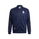 Campera deportiva Adidas del Real Madrid, modelo Match Day Essentials, color azul marino con detalles dorados en las mangas y cierre frontal completo.