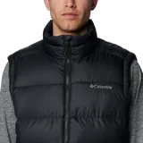 Chaleco acolchado Columbia de color negro con cierre frontal completo, cuello alto y tecnología Omni-Heat™ para retención de calor. Cuenta con bolsillos laterales con cierre y logo de la marca bordado en el pecho.
