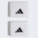 Par de muñequeras deportivas Adidas color blanco, con logo bordado en negro.