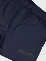 Short de baño Diesel color azul marino, con cintura elástica y cordón ajustable. Presenta el logo de la marca estampado en tono sobre tono en la parte inferior.