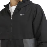 Campera ligera con capucha y cierre frontal, diseño color block en negro, marrón y beige. Cuenta con interior de polar y puños elásticos.