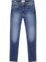 Jeans de calce slim, color azul, con pierna ajustada y tiro bajo.