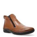 Botas cortas de cuero color suela, con cierre lateral y suela de goma negra.