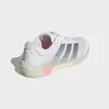 Championes de entrenamiento Adidas Dropset 4, color blanco con detalles plateados y suela en tono crema con acento naranja. Presentan un diseño técnico con empeine de malla transpirable, refuerzos en el talón y suela de caucho Continental para mayor tracción.