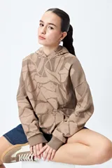 Canguro con capucha y bolsillo canguro frontal, de corte relajado. Presenta un estampado floral en tonos café y beige.