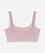 Soutien top color rosa claro, de poliamida con acabado seamless, escote redondo y breteles anchos fijos.