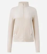 Campera deportiva de microfibra color beige con cuello alto y cierre frontal de cremallera.