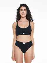 Soutien maternal negro sin costuras, con breteles regulables y broche frontal para amamantar.