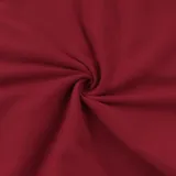 Top corto rojo con escote off-shoulder y mangas largas abullonadas.