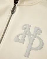 Campera con cierre frontal de Nude Project, confeccionada en algodón de alto gramaje con diseño oversized. Presenta capucha, bolsillos tipo canguro y un parche bordado con las iniciales NP en el pecho.