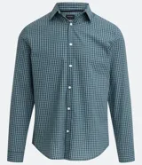 Camisa de corte slim con estampado de cuadros pequeños en tonos azul y verde. Presenta cuello camisero, cierre frontal con botones y mangas largas con puños abotonados.