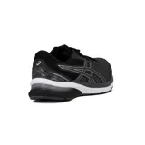 Championes de running Asics Gel-Shogun 4, color negro con detalles plateados y suela blanca.