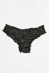 Pantie de viscosa negra con estampado de lunares blancos y terminaciones de encaje negro.