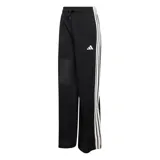 Pantalón de mujer Adidas tipo jogging en color negro, con diseño de malla transpirable, corte ancho y franjas blancas laterales con las clásicas tres tiras de la marca. Cuenta con cintura elástica con cordón de ajuste y logo bordado en la pierna.