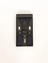 Tiradores azules con detalles de cuero negro y broches metálicos plateados, presentados en una caja negra.