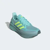 Championes de running Adidas Ultraboost 5, color verde azulado (teal) con detalles en amarillo neón. Presentan un empeine de tejido PRIMEKNIT y una mediasuela con tecnología Light BOOST V2.
