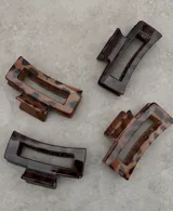 Broche para el pelo tipo clip, de acetato color carey con diseño geométrico.