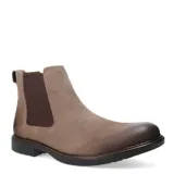 Bota tipo Chelsea de hombre en color taupe, confeccionada en cuero gamuzado con efecto desgastado en la puntera. Presenta paneles elásticos laterales en color marrón oscuro, tirador en el talón y suela de goma negra con costura vista.