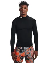 Remera de compresión Under Armour de manga larga con cuello alto, confeccionada en tejido de doble capa con interior cepillado. Presenta un diseño ergonómico con paneles de malla para ventilación y material elástico en cuatro direcciones.