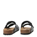 Sandalias tipo Birkenstock marca Freeway, color negro, con doble tira ajustable mediante hebillas metálicas y plantilla anatómica de corcho.